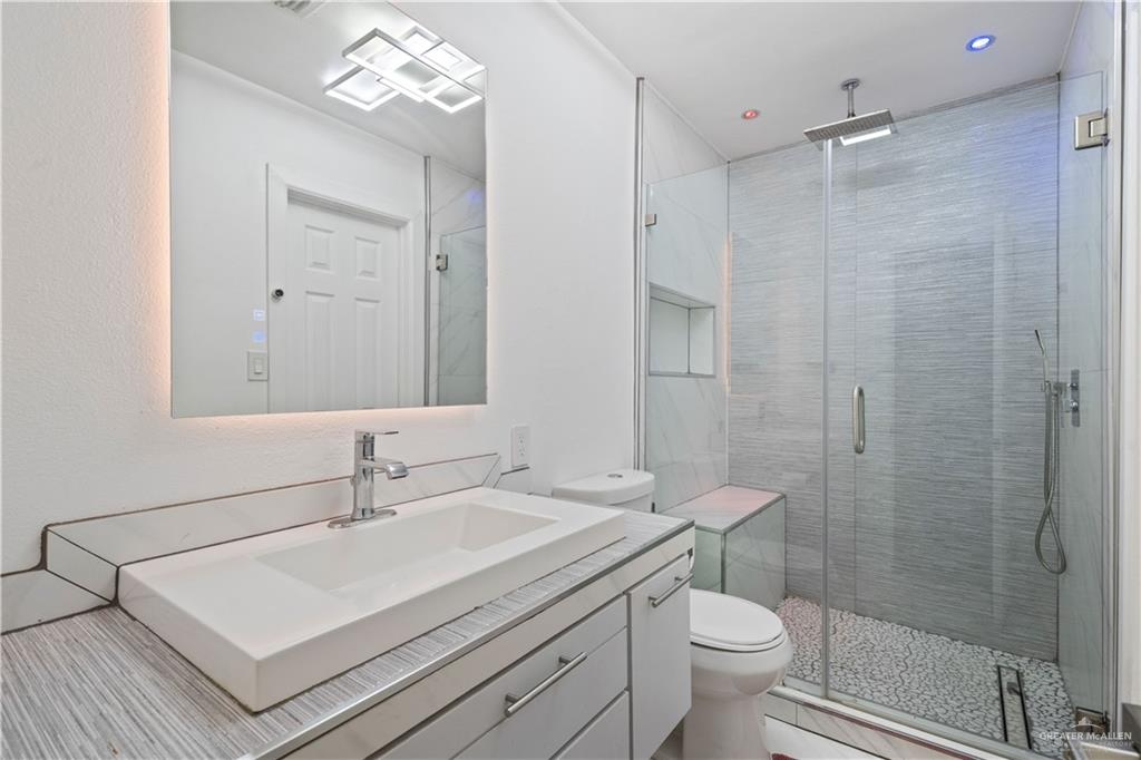 415 North 8th Street Hidalgo, TX 78557 - Photo 12 of 21 a bathroom with a sink toilet and shower