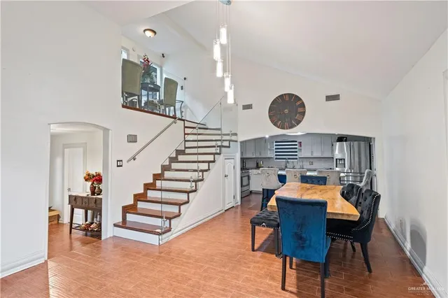 a view of a dining room with furniture and wooden floor