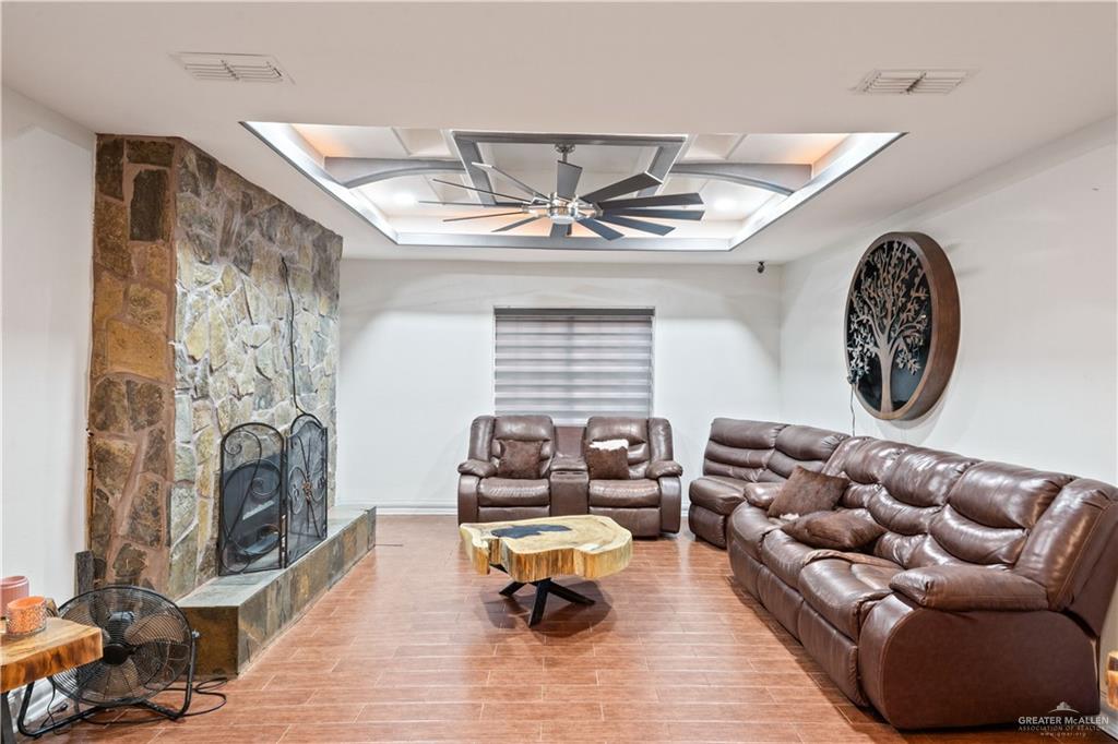 415 North 8th Street Hidalgo, TX 78557 - Photo 6 of 21 a living room with furniture and a fireplace