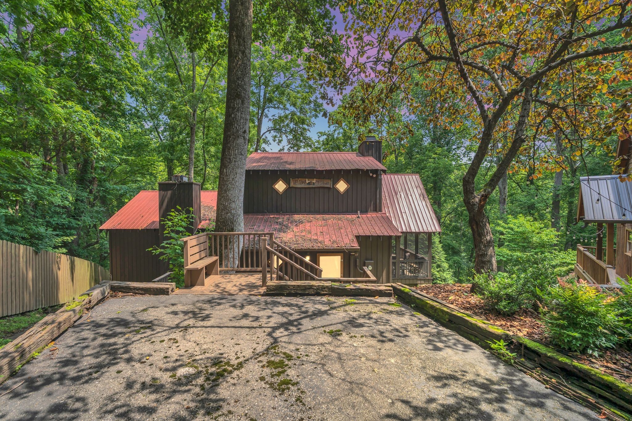 110 Village Way Lancaster, TN 38569 - Photo 2 of 27 a backyard of a house with yard and outdoor seating