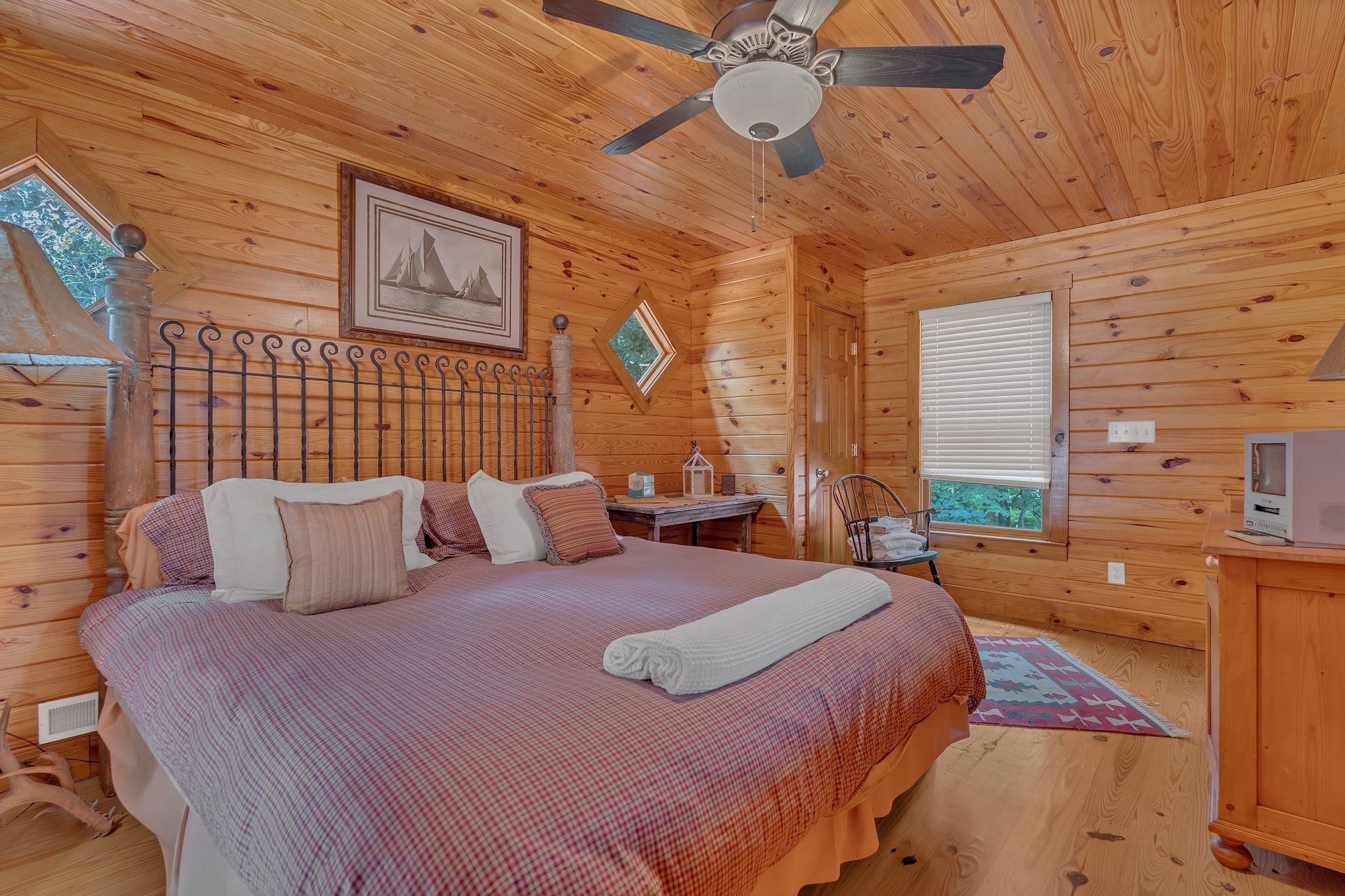 110 Village Way Lancaster, TN 38569 - Photo 22 of 27 a bedroom with a bed and a chandelier