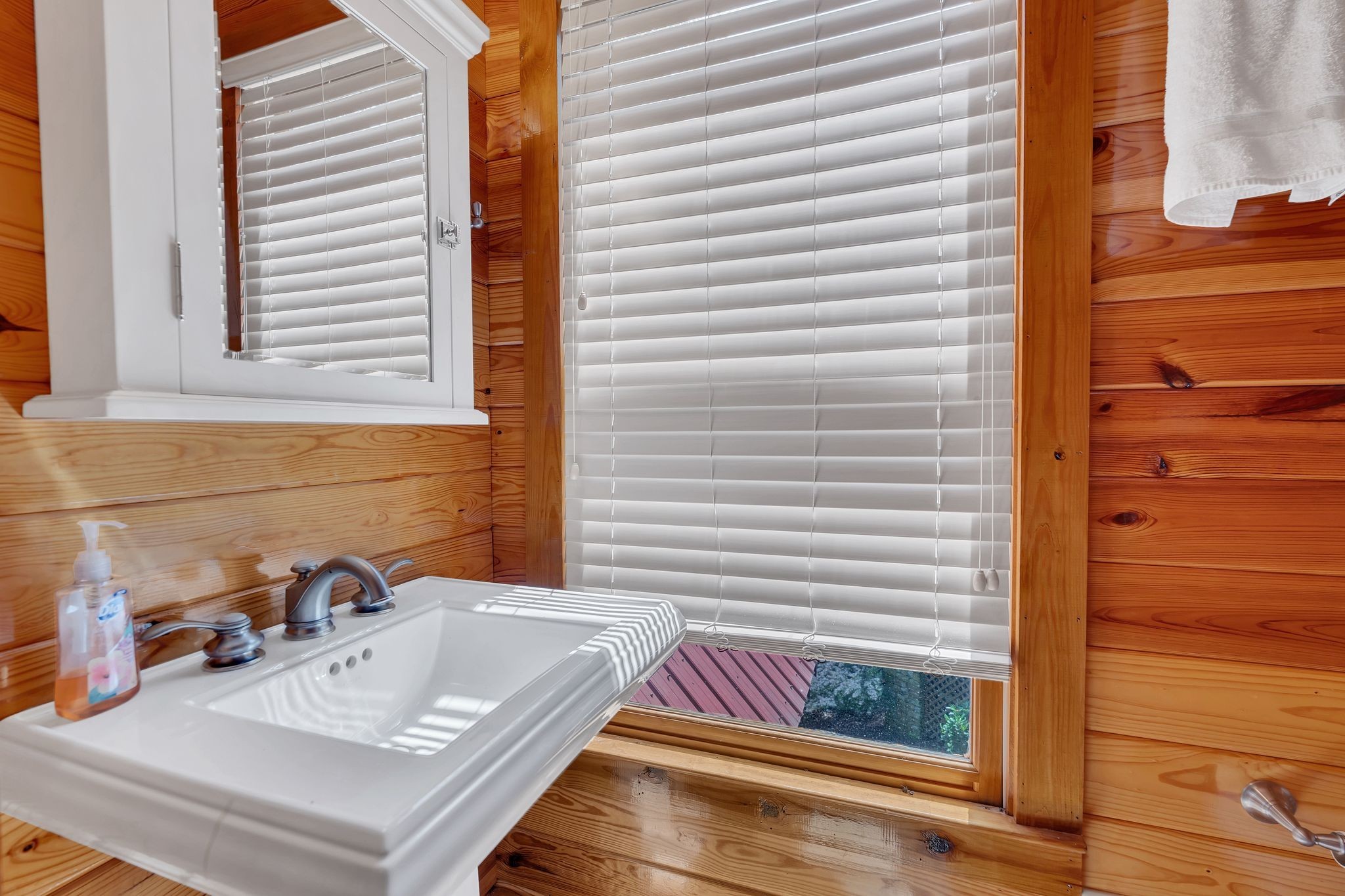 110 Village Way Lancaster, TN 38569 - Photo 23 of 27 a bathroom with a sink and a window