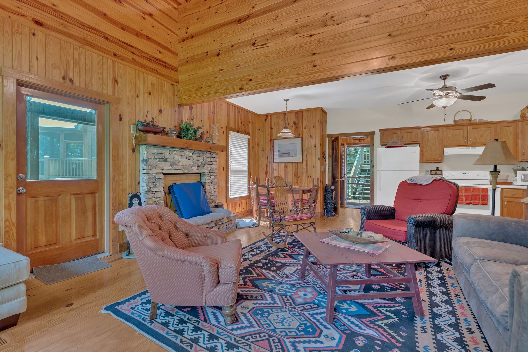 110 Village Way Lancaster, TN 38569 - Photo 10 of 27 a living room with furniture a fireplace and a table