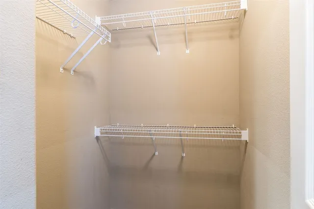 a view of a room with racks on the wall