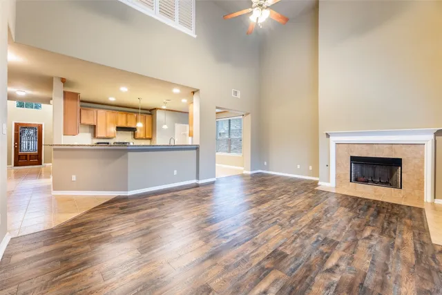 a view of a kitchen with a sink and a fireplace