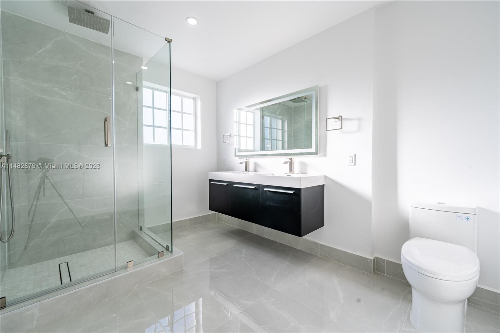 14346 Southwest 134th Place Miami, FL 33186 - Photo 23 of 36 a bathroom with a sink toilet and shower