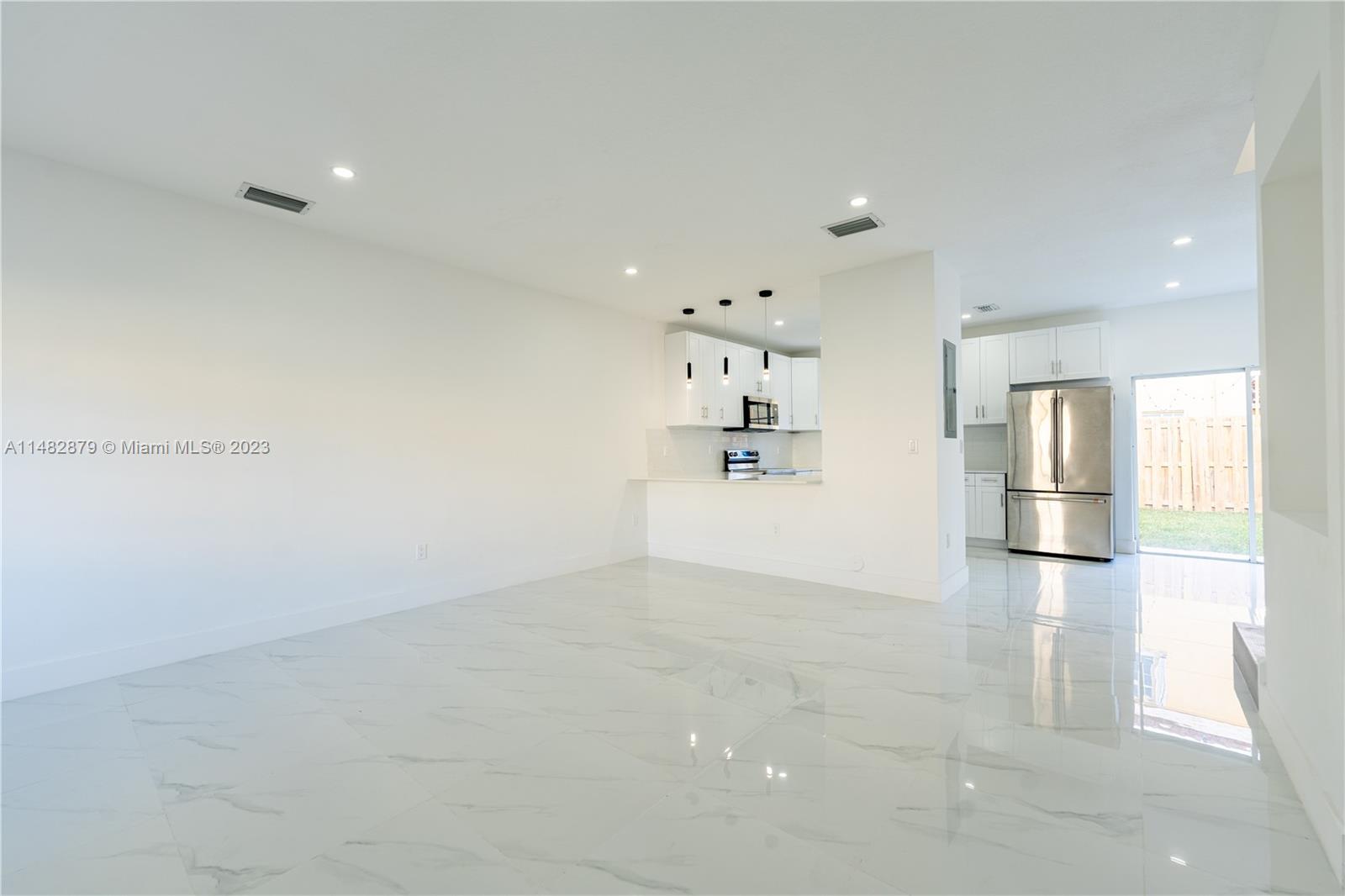 14346 Southwest 134th Place Miami, FL 33186 - Photo 25 of 36 a view of empty room with wooden floor