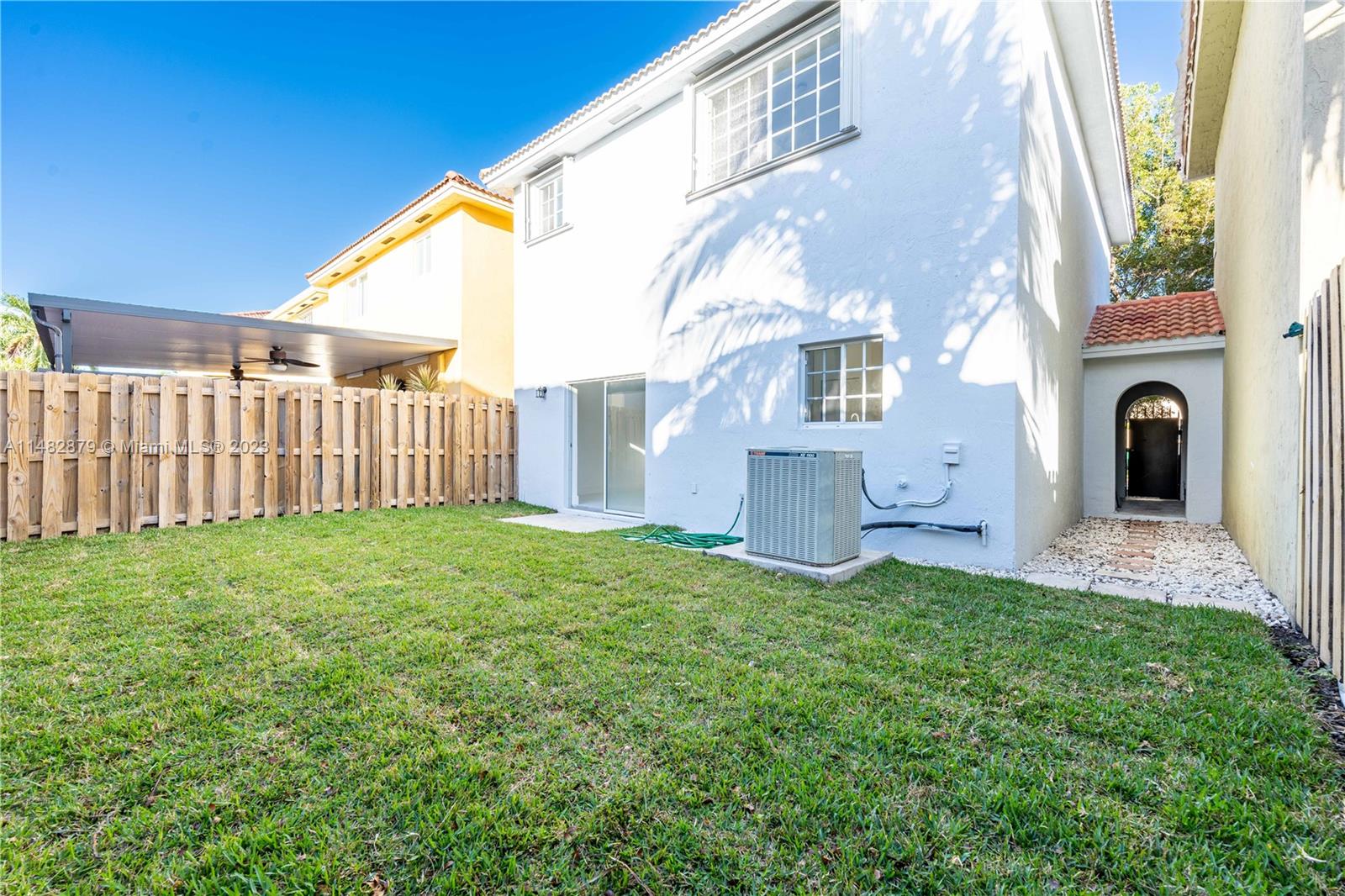 14346 Southwest 134th Place Miami, FL 33186 - Photo 26 of 36 a view of a house with a yard and a chair