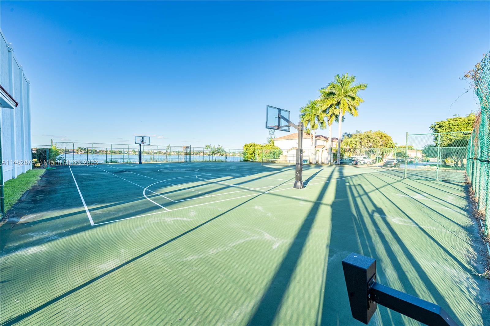 14346 Southwest 134th Place Miami, FL 33186 - Photo 30 of 36 a view of an outdoor space and tennis court