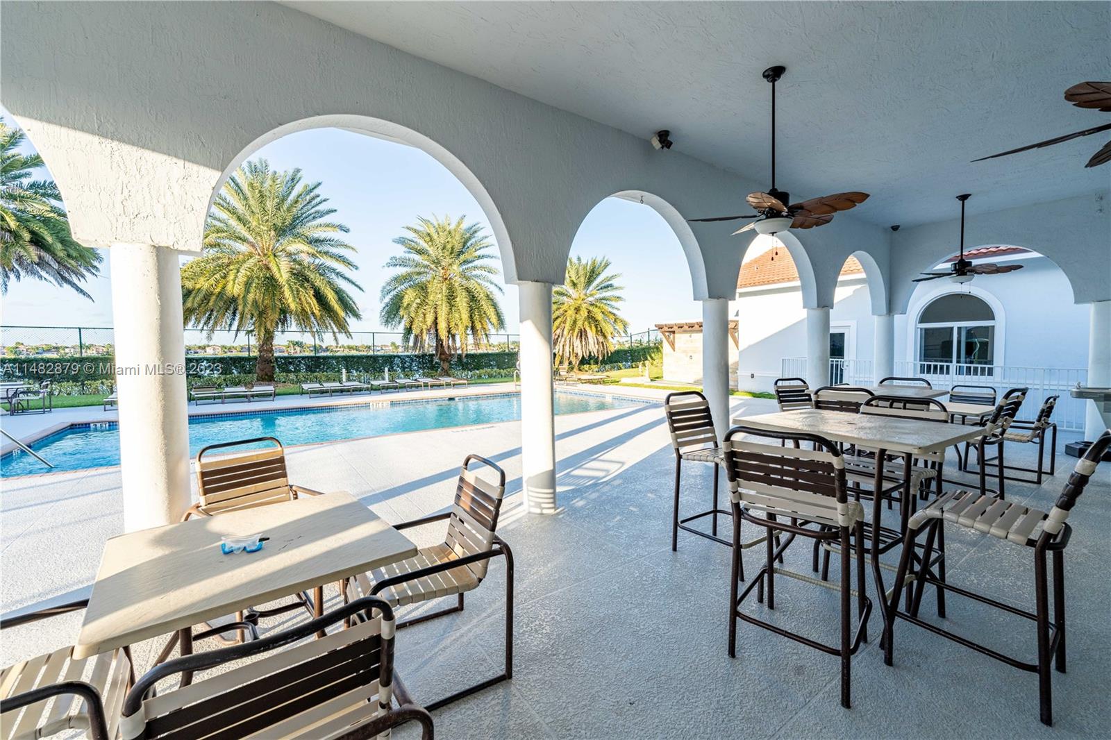 14346 Southwest 134th Place Miami, FL 33186 - Photo 34 of 36 a view of a dining room with furniture window and wooden floor
