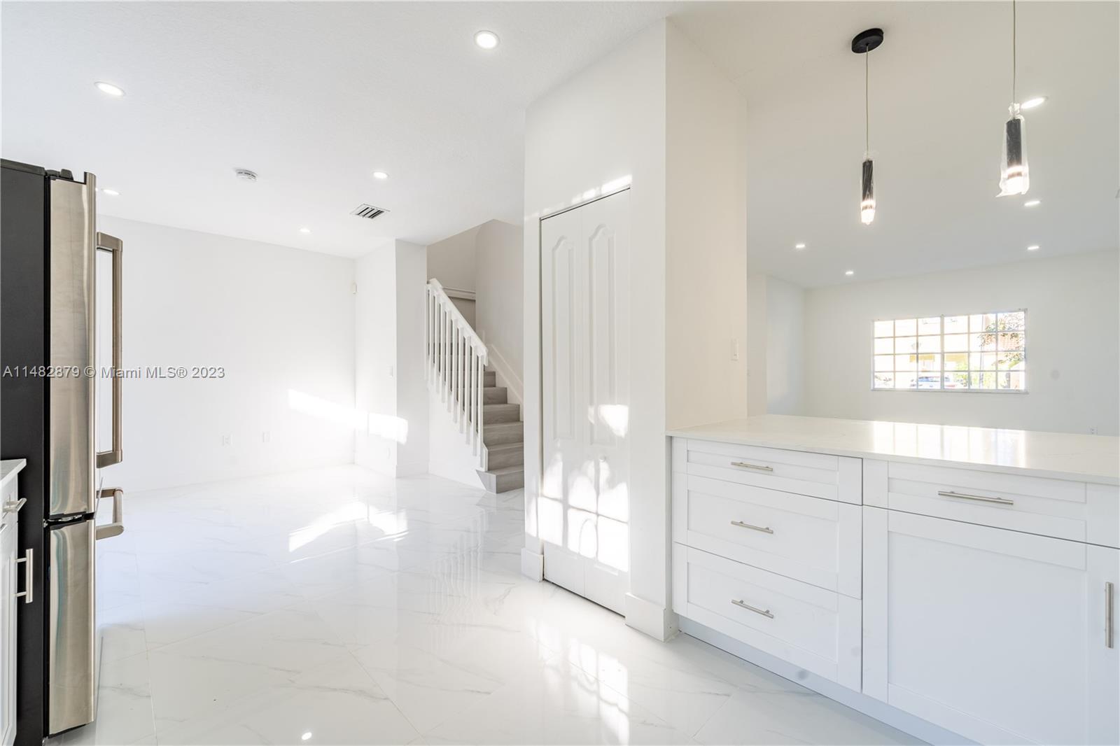 14346 Southwest 134th Place Miami, FL 33186 - Photo 8 of 36 a view of hallway with mirror and a shower