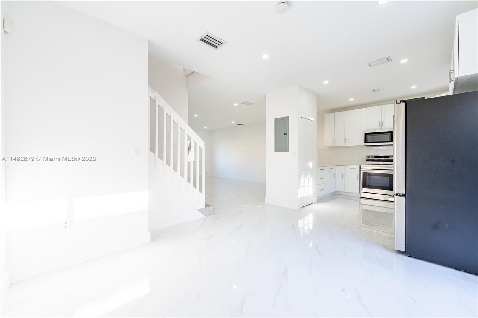 14346 Southwest 134th Place Miami, FL 33186 - Photo 10 of 36 a view of kitchen with furniture and refrigerator