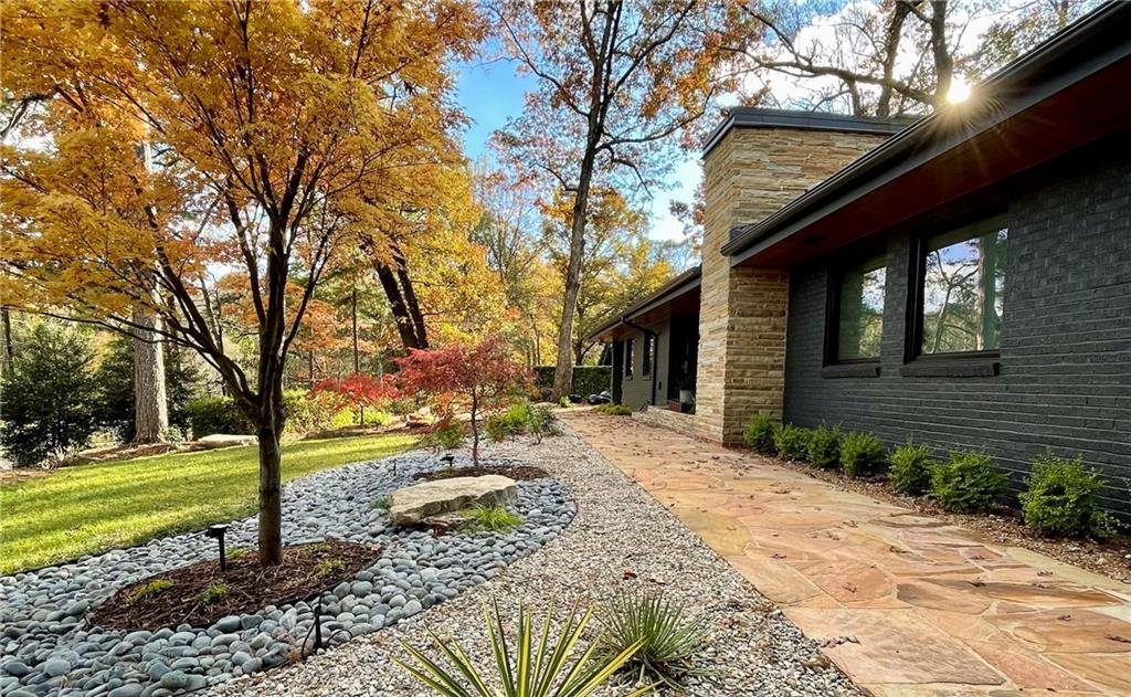 1904 Lenox Road Northeast Atlanta, GA 30306 - Photo 2 of 56 a front view of a house with a yard