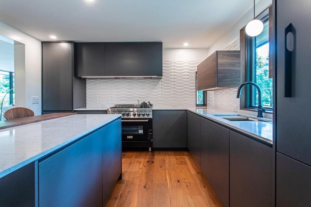 1904 Lenox Road Northeast Atlanta, GA 30306 - Photo 21 of 56 a kitchen with stainless steel appliances a sink stove and refrigerator