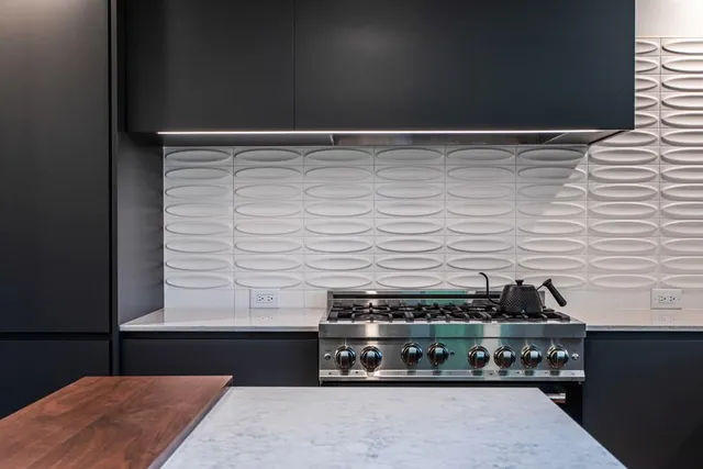 a view of a bathroom with sink and mirror
