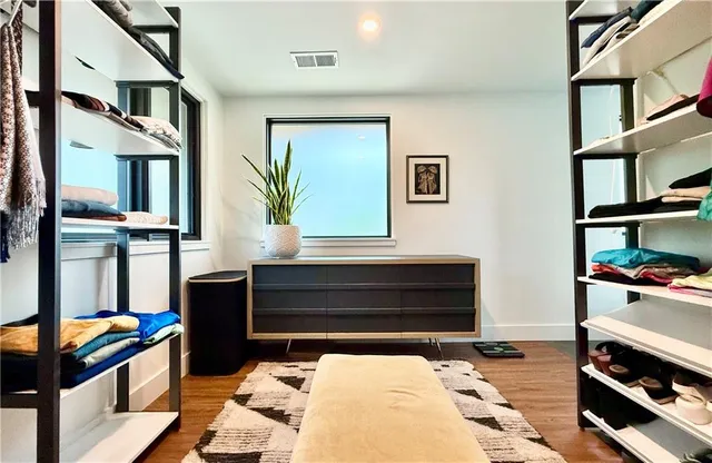 a bathroom with a sink toilet and a mirror