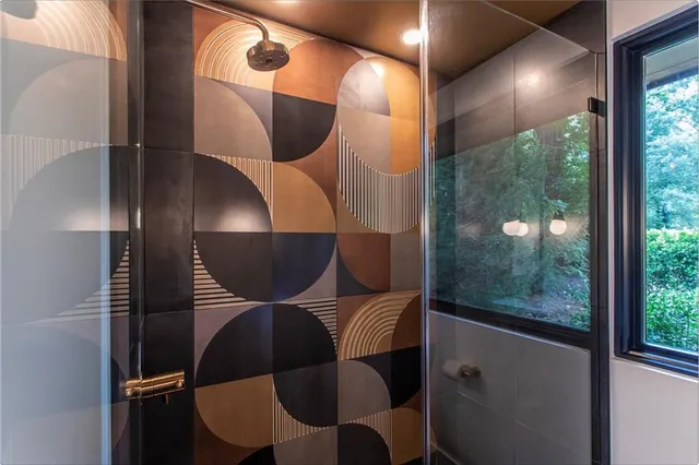 a view of a swimming pool with lawn chairs under an umbrella