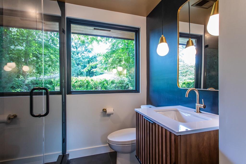 1904 Lenox Road Northeast Atlanta, GA 30306 - Photo 35 of 56 a bathroom with a sink toilet and a mirror