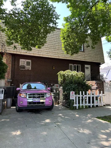 a car parked in front of a house