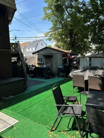 a view of a patio in backyard