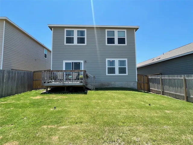 a view of backyard with deck