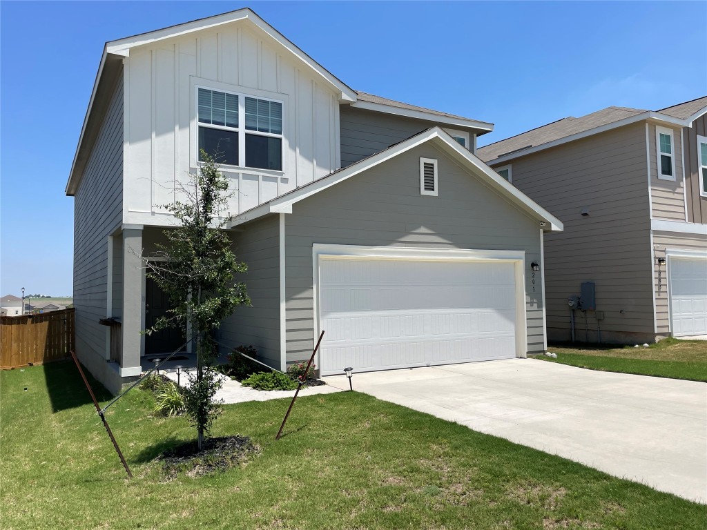 201 Comancheros Road Jarrell, TX 76537 - Photo 4 of 33 The spacious lot has room for 4 cars in the driveway and 2 in the garage.