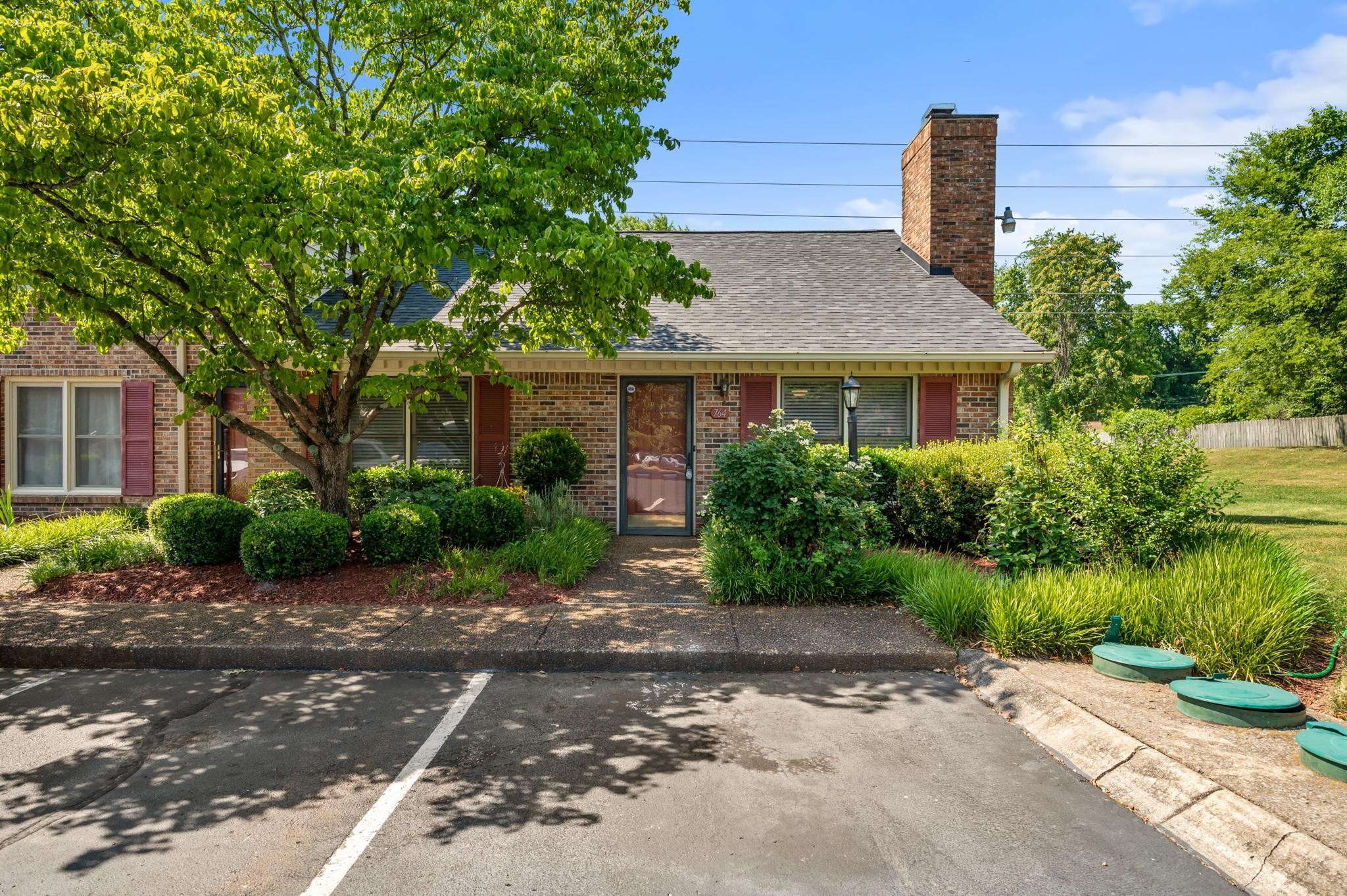 764 Kent Road Nashville, TN 37214 - Photo 1 of 20 a front view of a house with a garden