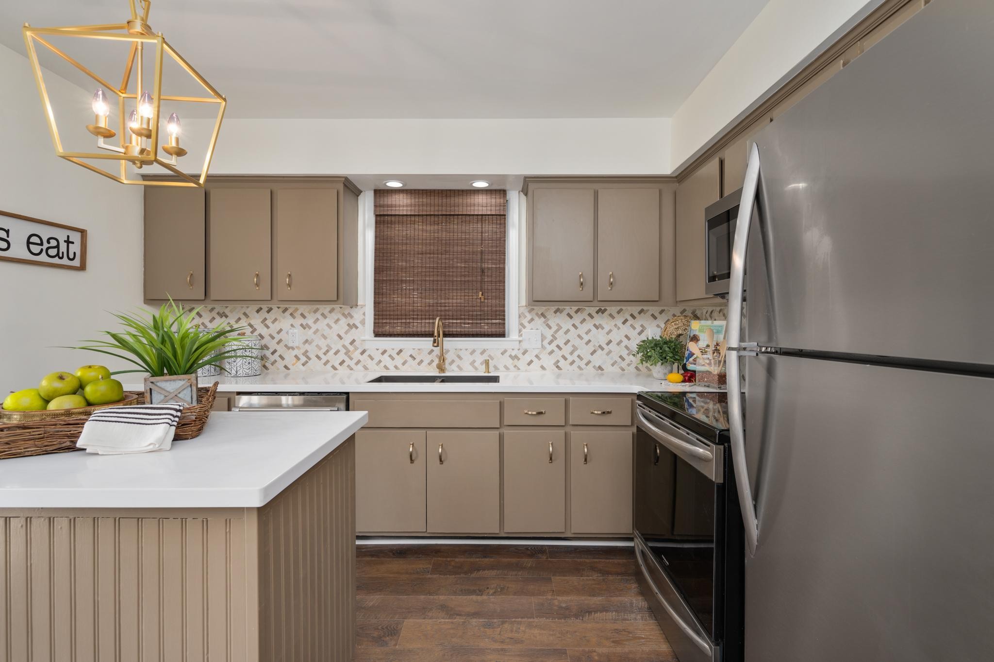 764 Kent Road Nashville, TN 37214 - Photo 5 of 20 a kitchen with stainless steel appliances granite countertop a sink a stove and a refrigerator