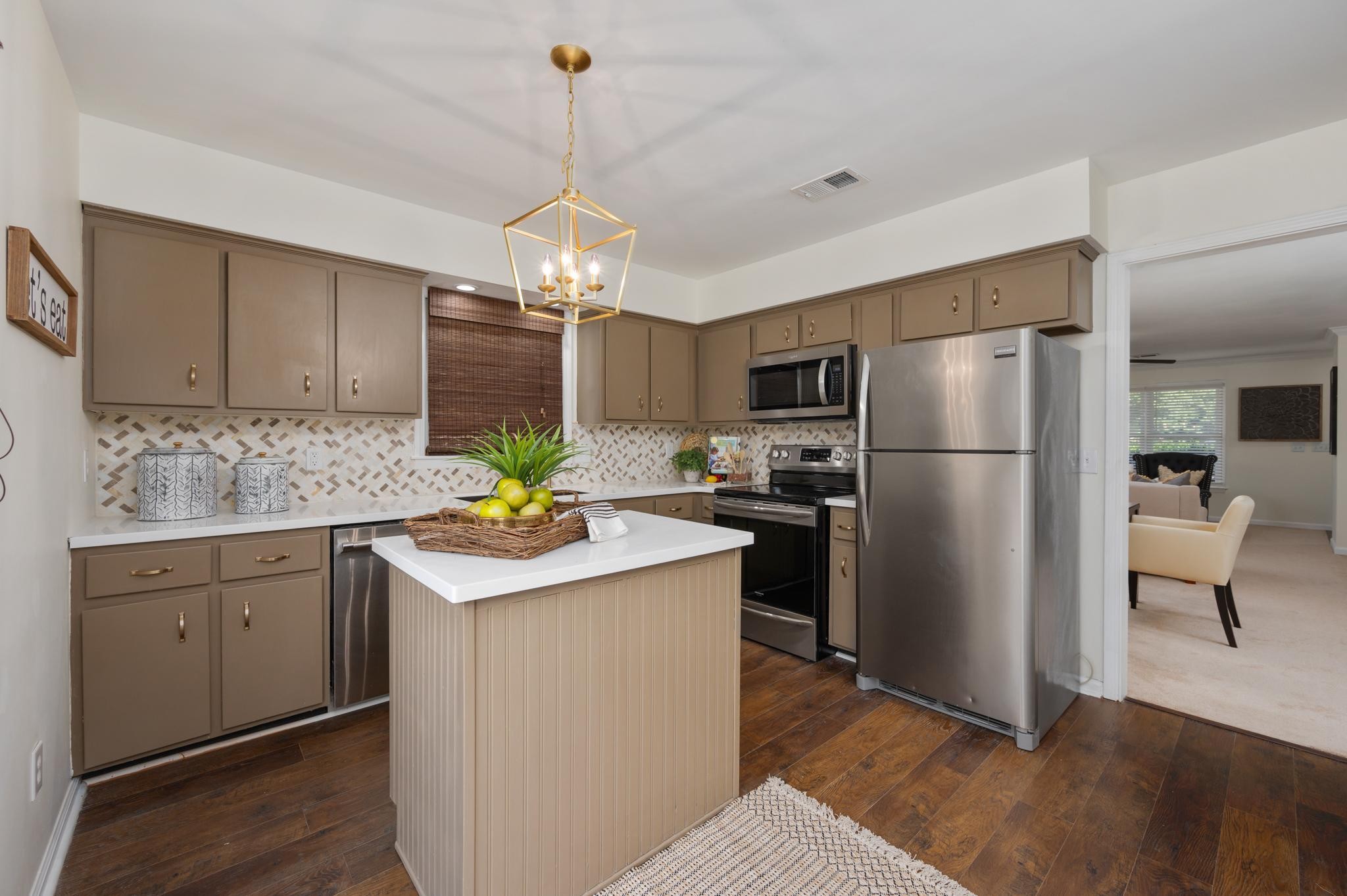 764 Kent Road Nashville, TN 37214 - Photo 7 of 20 a kitchen with refrigerator cabinets and wooden floor