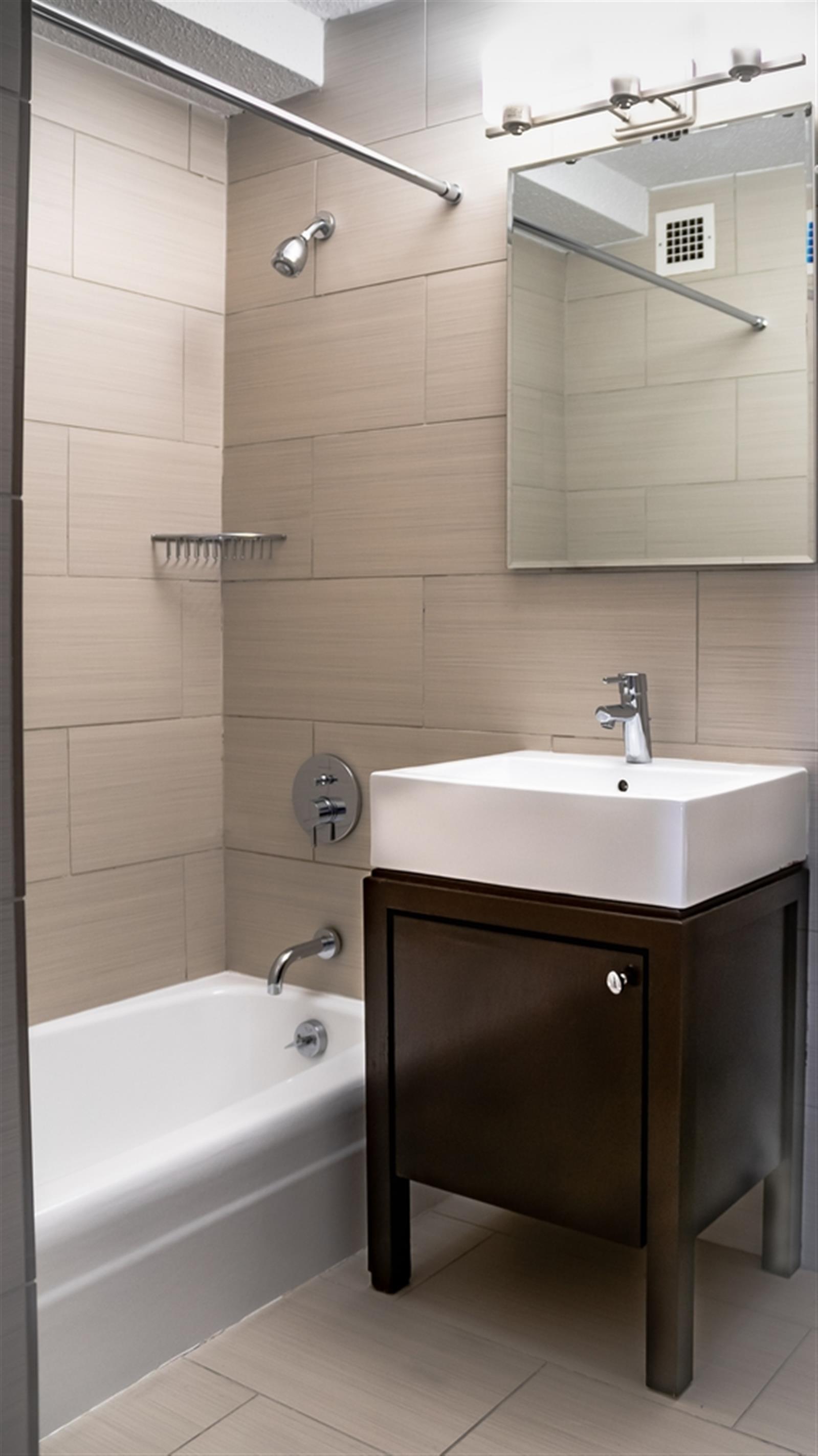 470 2nd Avenue, Unit 15B Manhattan, NY 10016 - Photo 4 of 4 a bathroom with a sink and a bathtub
