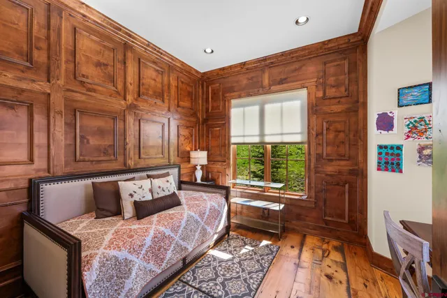 a bedroom with furniture and a window