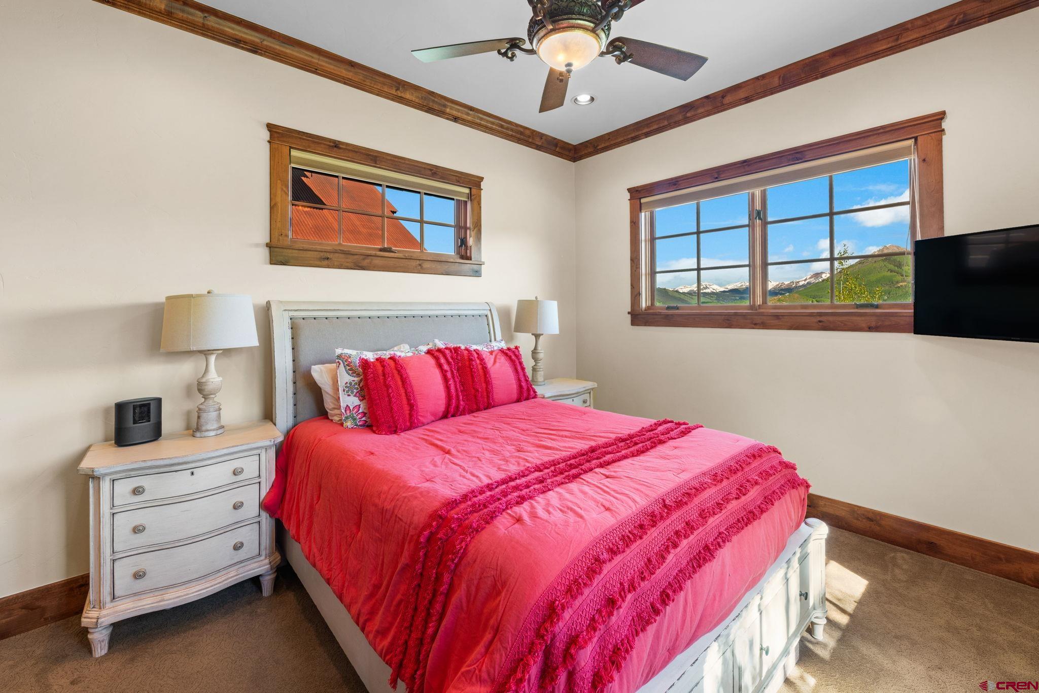 59 Summit Road Crested Butte, CO 81225 - Photo 16 of 45 a bedroom with a bed and a flat screen tv