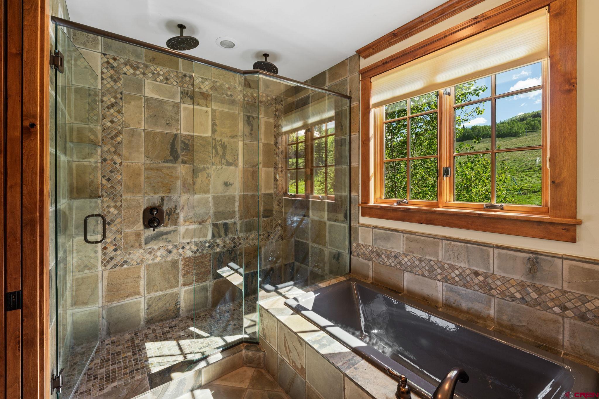 59 Summit Road Crested Butte, CO 81225 - Photo 18 of 45 a bathroom with a bathtub and shower