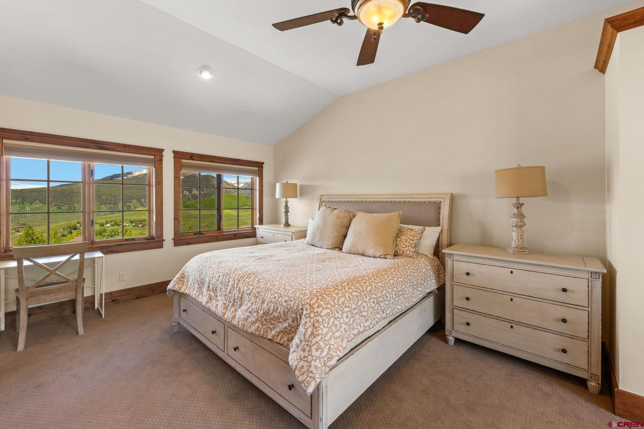 59 Summit Road Crested Butte, CO 81225 - Photo 19 of 45 a bed room with a bed and a chair