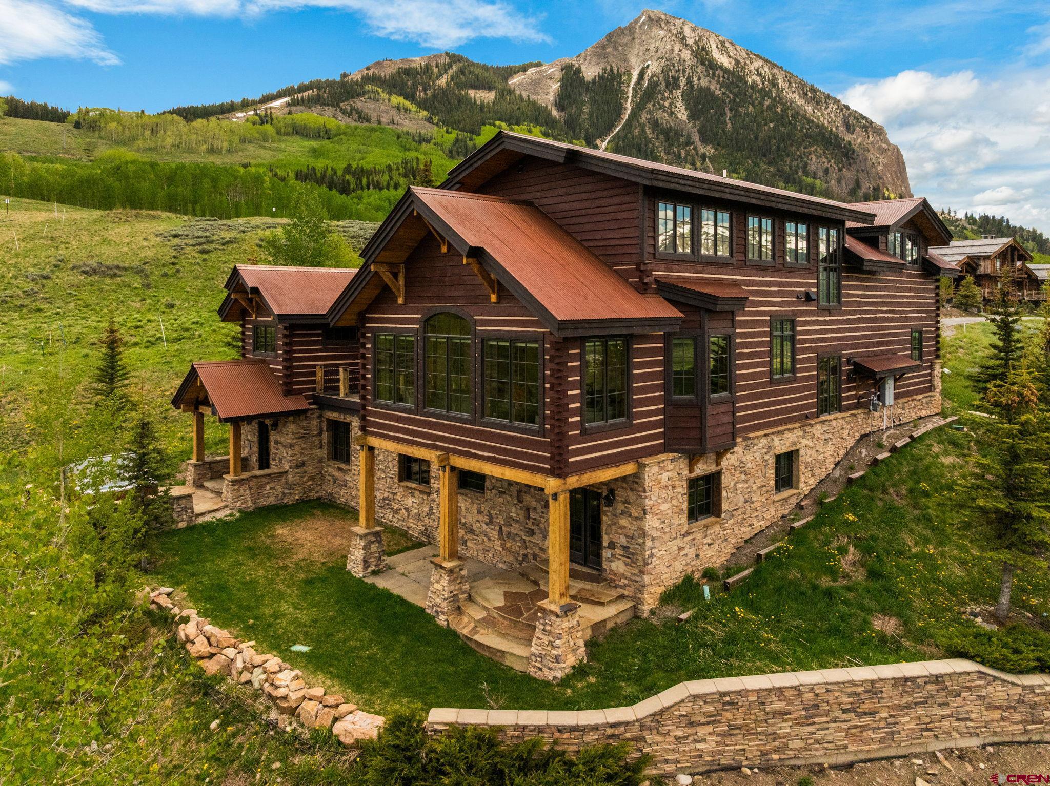 59 Summit Road Crested Butte, CO 81225 - Photo 2 of 45 front view of house with a yard