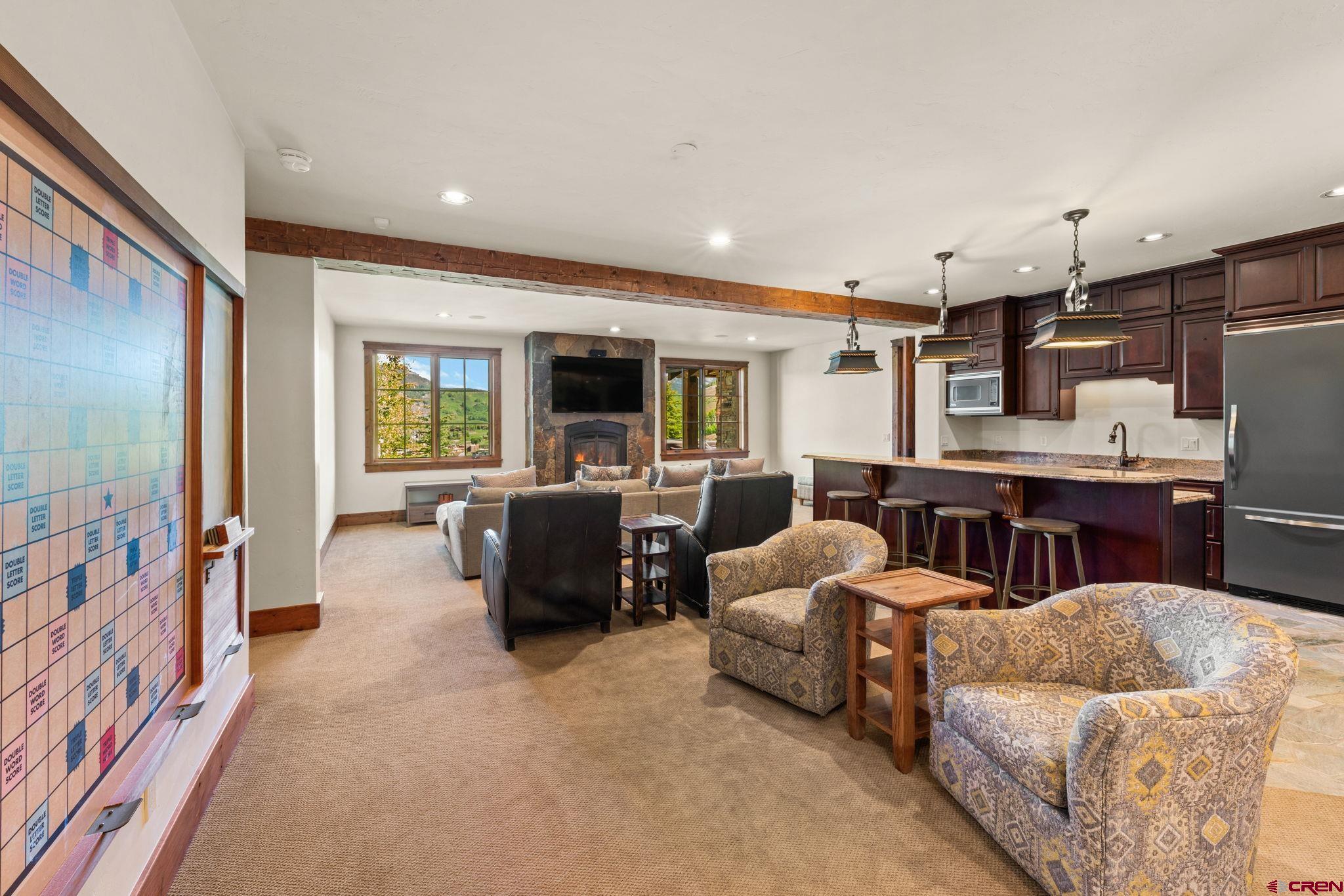 59 Summit Road Crested Butte, CO 81225 - Photo 28 of 45 a living room with furniture and a flat screen tv