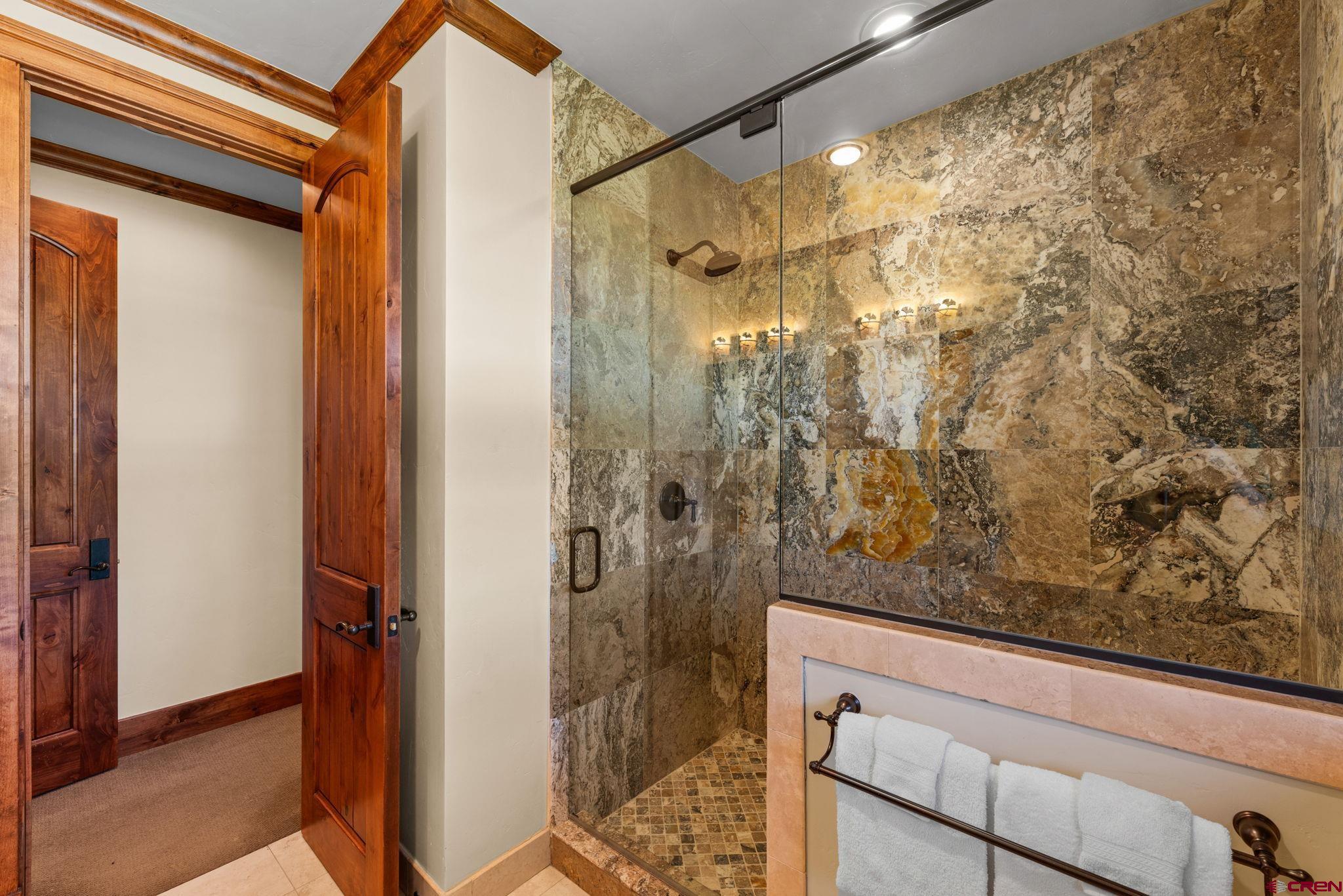 59 Summit Road Crested Butte, CO 81225 - Photo 34 of 45 a bathroom with a shower and a sink