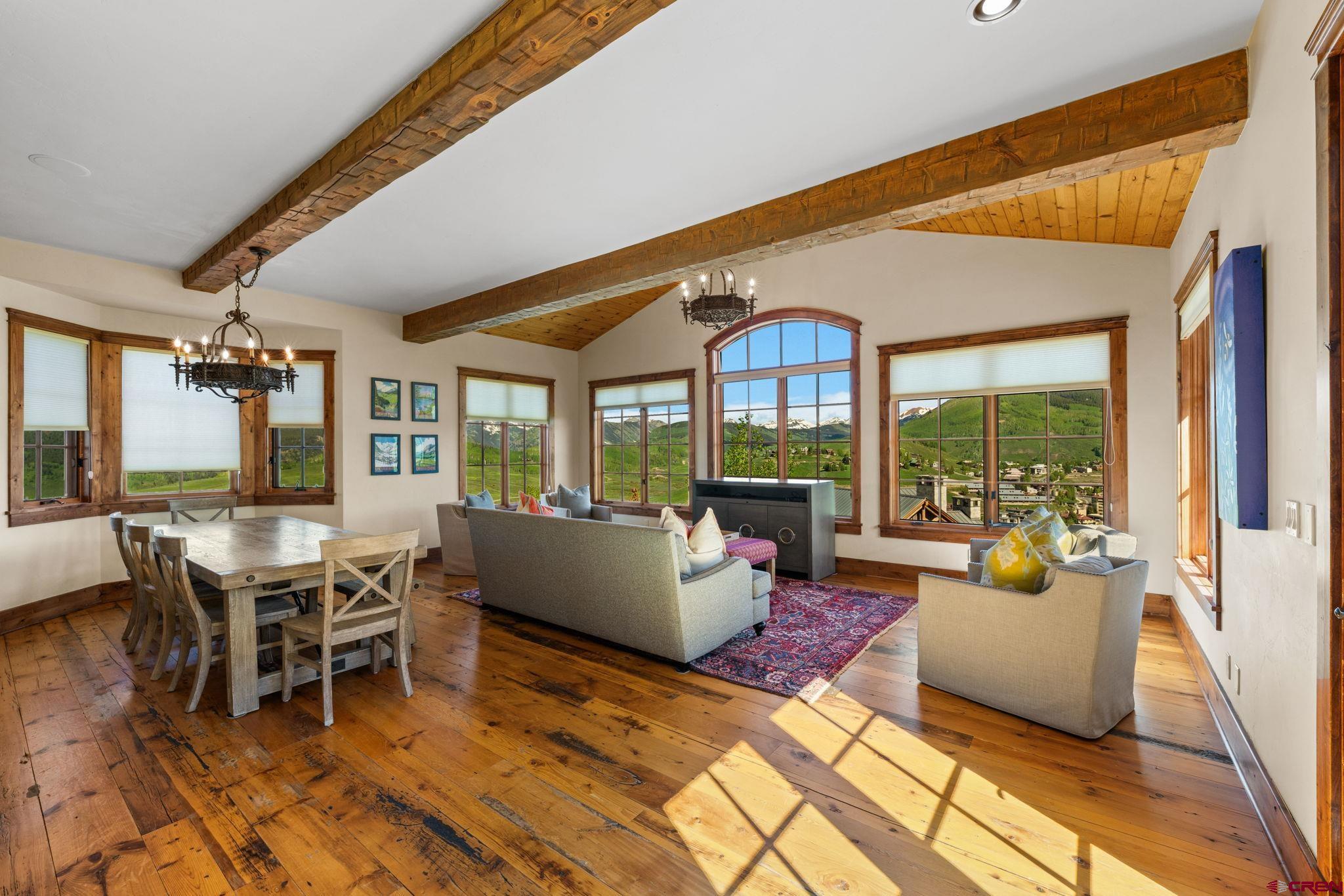 59 Summit Road Crested Butte, CO 81225 - Photo 10 of 45 a living room with furniture and large windows