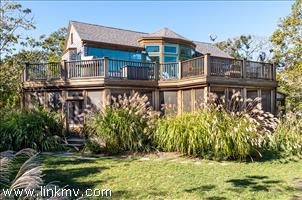 72 Chappaquiddick Road Edgartown, MA 02539 - Photo 1 of 13 a front view of a house with a yard