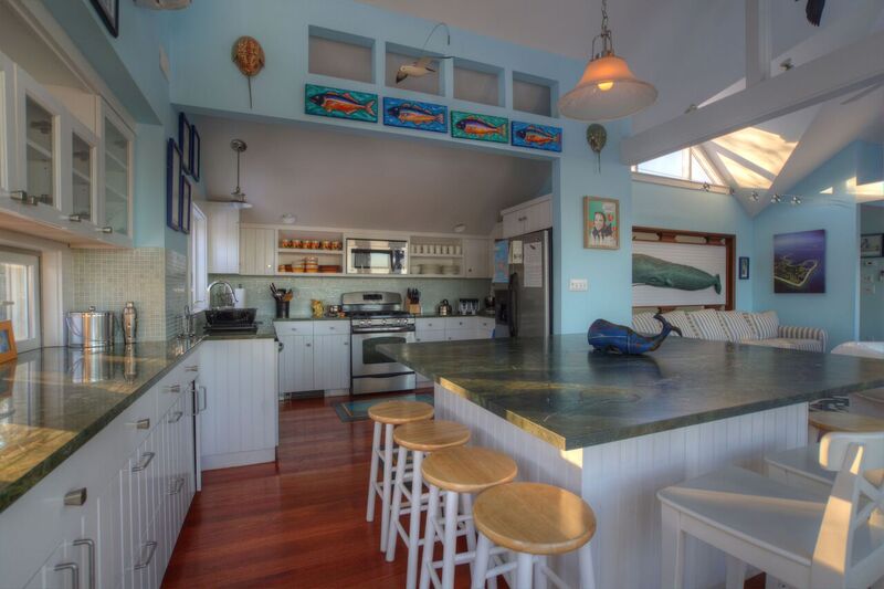 72 Chappaquiddick Road Edgartown, MA 02539 - Photo 4 of 13 a kitchen with stainless steel appliances granite countertop a sink a stove and a wooden cabinets