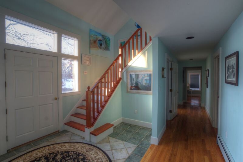 72 Chappaquiddick Road Edgartown, MA 02539 - Photo 9 of 13 a view of a hallway with wooden floor and stairs