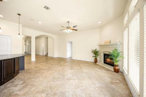 a view of an empty room with a fireplace