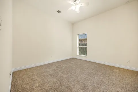 an empty room with a empty space and a window