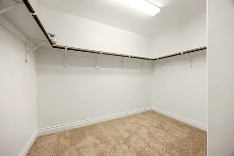 a view of an empty walk in closet