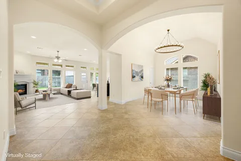 a living room with furniture and a table