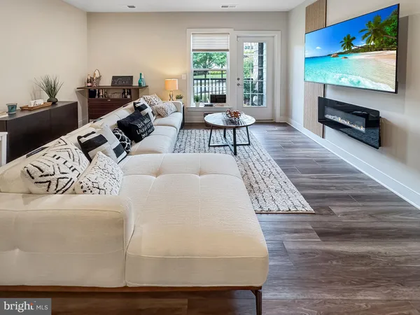 a living room with furniture and a rug