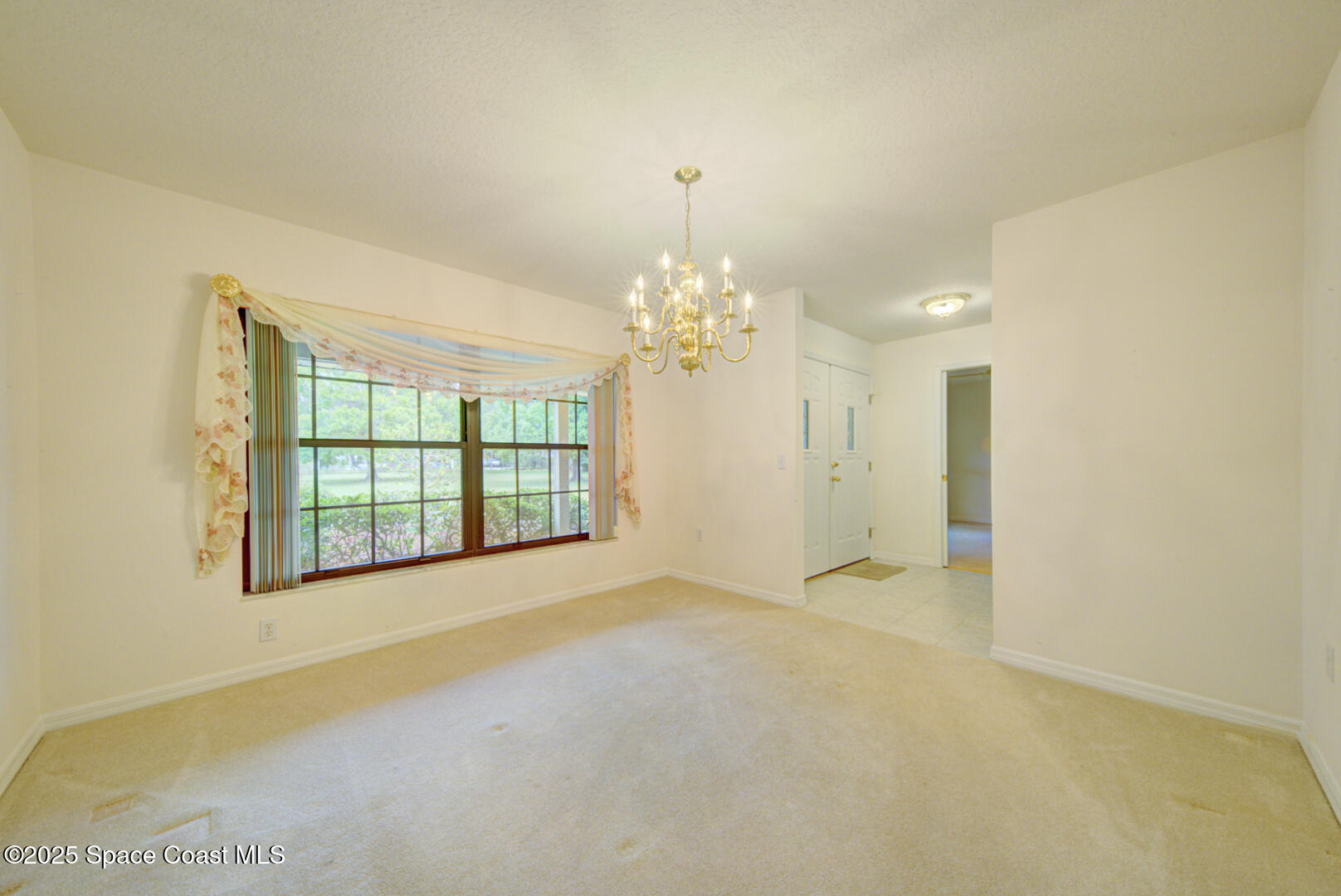 3105 Diamond Road Titusville, FL 32796 - Photo 15 of 81 a view of an empty room with a window