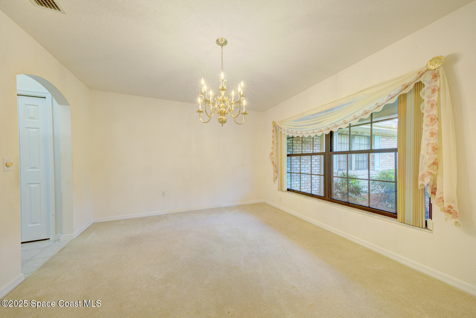 3105 Diamond Road Titusville, FL 32796 - Photo 16 of 81 a view of an empty room with a window