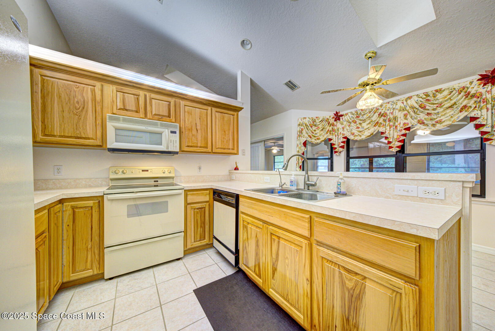 3105 Diamond Road Titusville, FL 32796 - Photo 20 of 81 a kitchen with stainless steel appliances granite countertop a sink and cabinets