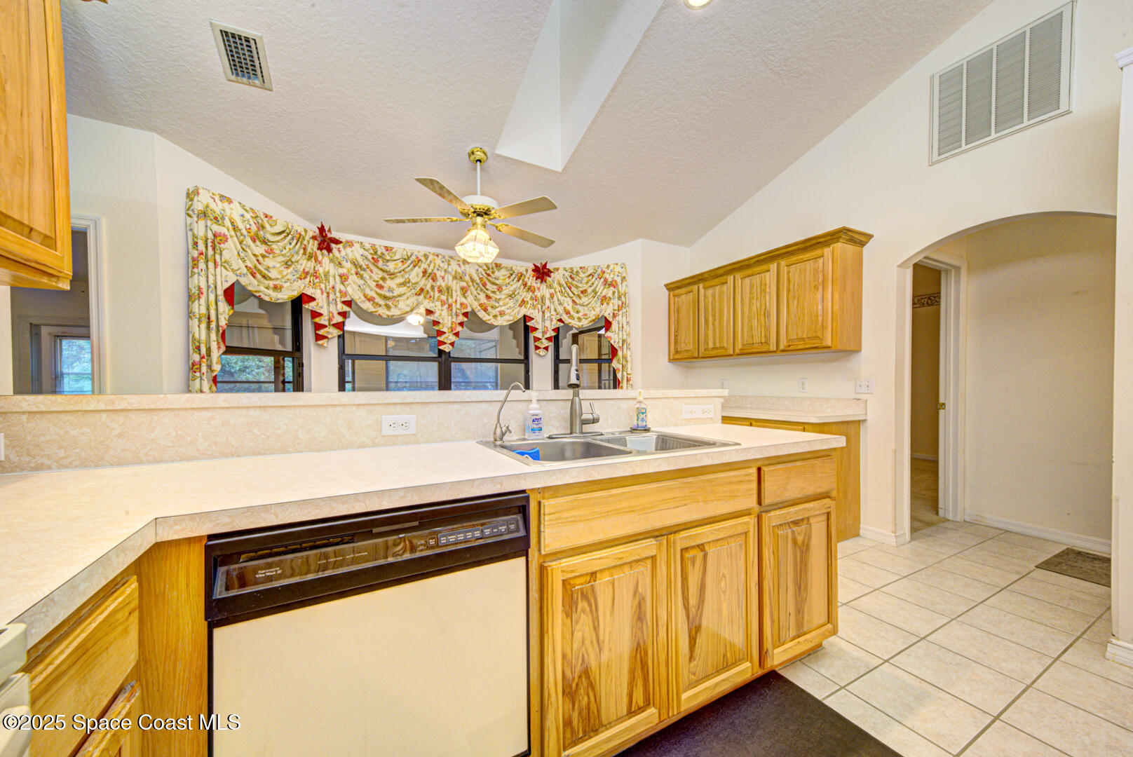 3105 Diamond Road Titusville, FL 32796 - Photo 21 of 81 a kitchen with stainless steel appliances a sink and a refrigerator